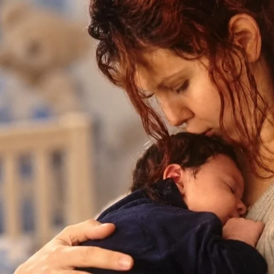 Korinna Leányvári holding her baby son